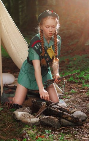 1 dark haired female tortures another during lezdom play in concrete cellar